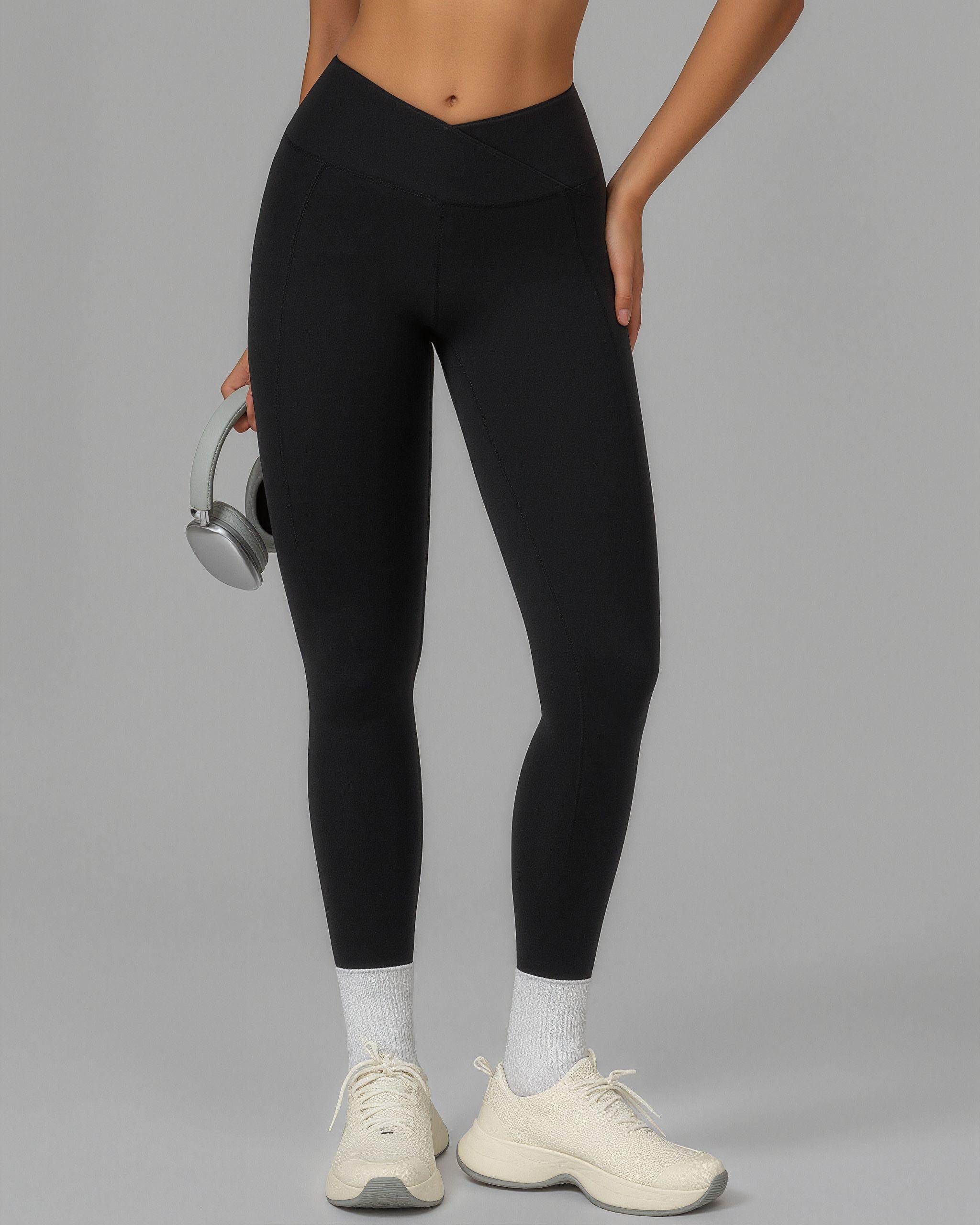 Leggings schwarz Hohe Crossover-Taille Seiten Taschen Medium-Shot für Workout und Kompression